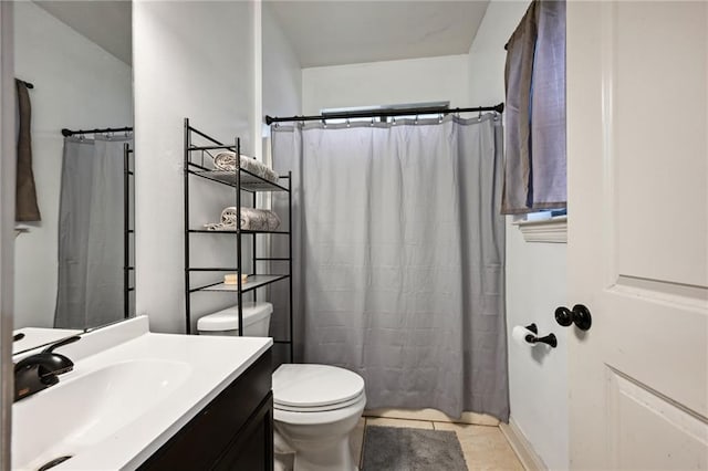 bathroom with tile patterned flooring, vanity, a shower with shower curtain, and toilet