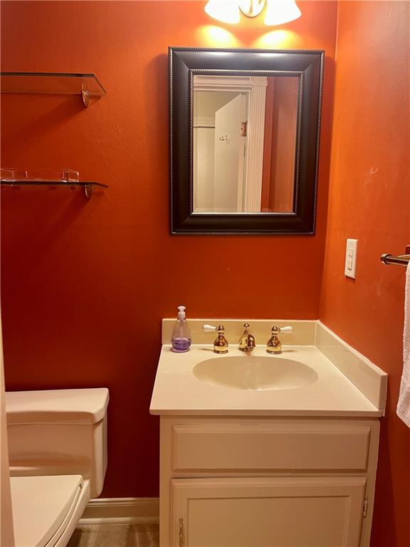 bathroom with vanity and toilet