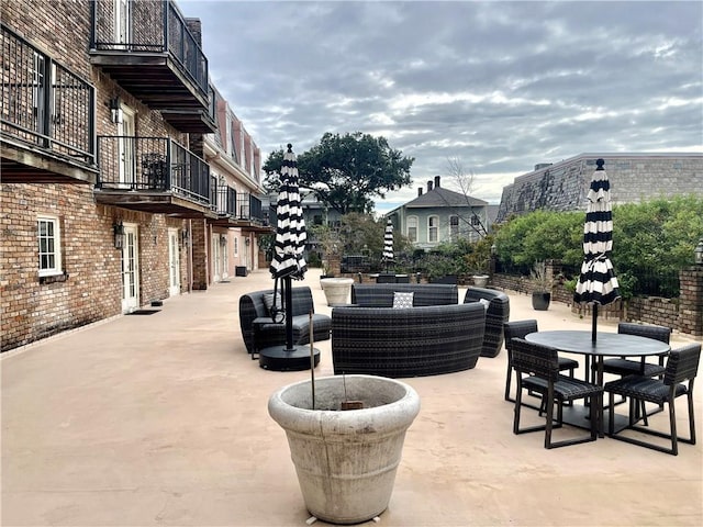 view of community with a patio area and an outdoor hangout area