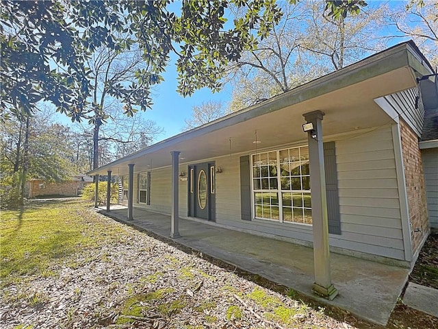 view of property exterior featuring a porch