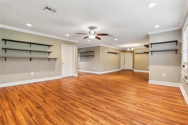 unfurnished living room with ceiling fan, crown molding, and light hardwood / wood-style flooring