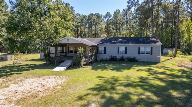 view of front of house with a porch and a front lawn