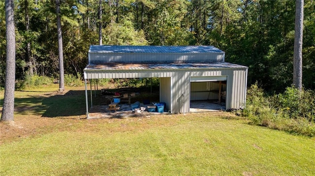 view of outbuilding featuring a garage and a lawn