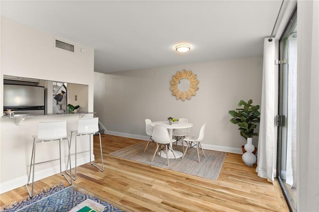 dining area with light hardwood / wood-style flooring