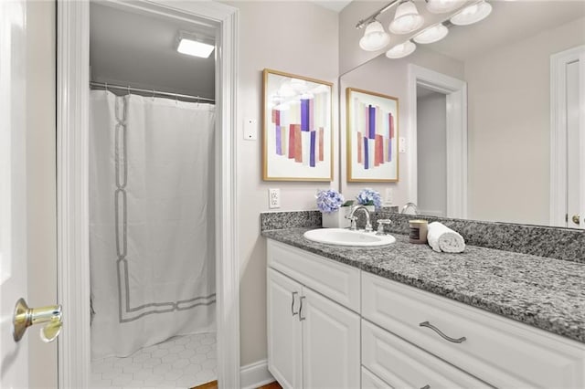 bathroom with a shower with curtain and vanity