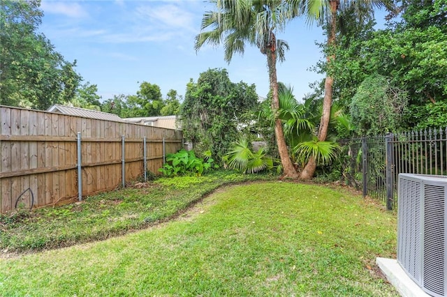 view of yard with central AC