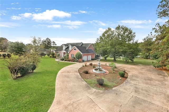 view of front of home with a garage and a front lawn