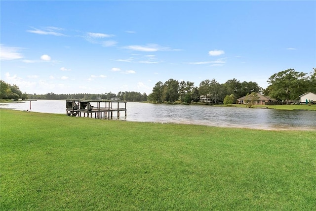 dock area featuring a yard and a water view