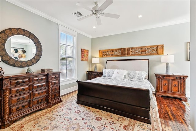 bedroom with ceiling fan, light hardwood / wood-style flooring, and crown molding