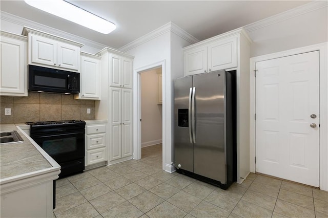 kitchen featuring white cabinetry, light tile patterned floors, black appliances, and tasteful backsplash