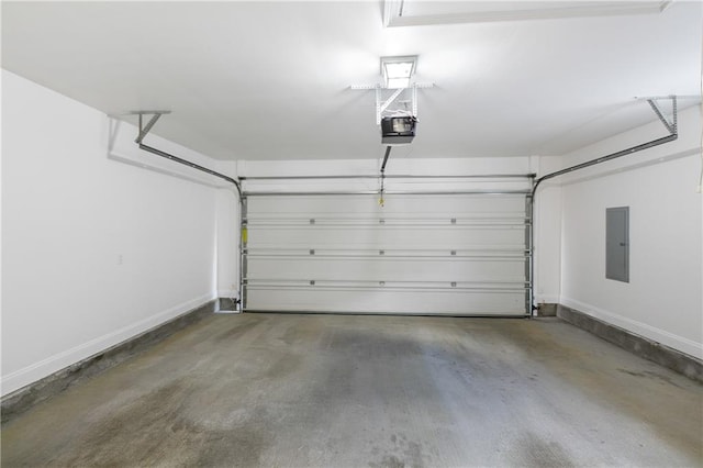 garage with electric panel and a garage door opener