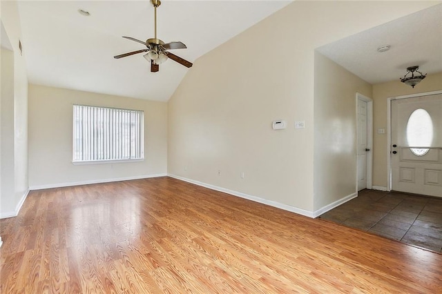 entrance foyer featuring wood-type flooring, ceiling fan, and lofted ceiling