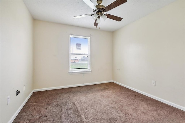 spare room with carpet flooring and ceiling fan