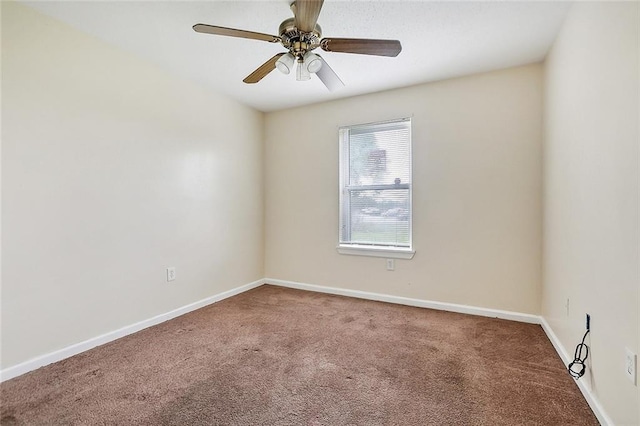 empty room featuring carpet and ceiling fan