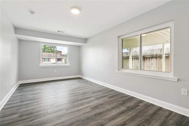 empty room featuring dark hardwood / wood-style floors