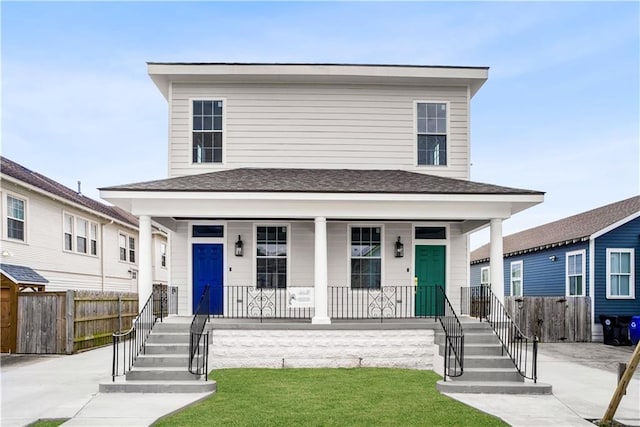 2610 Peniston St, New Orleans, LA 70115 - country-style home with a front yard and a porch