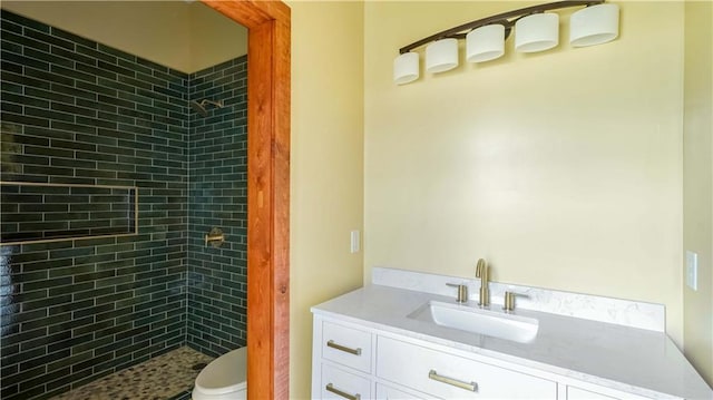 2610 Peniston St, New Orleans, LA 70115 - bathroom featuring toilet, vanity, and tiled shower