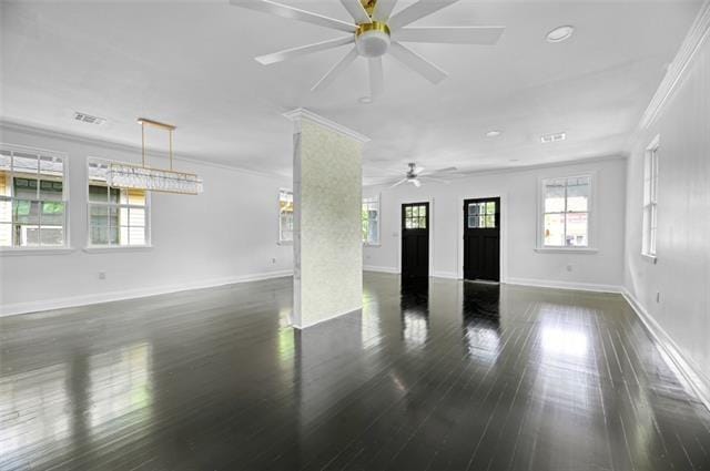 empty room with dark hardwood / wood-style floors, ceiling fan, and crown molding