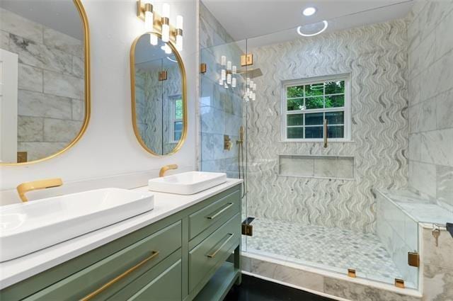 bathroom featuring vanity and a shower with door