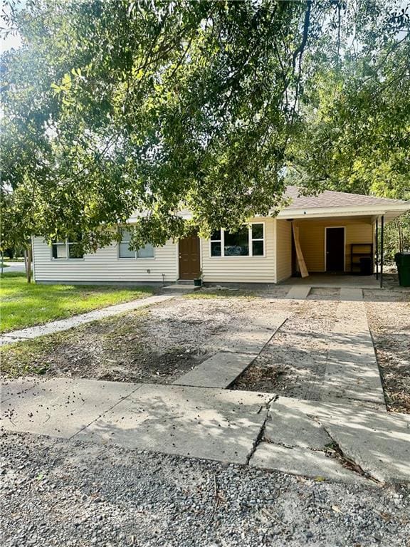 view of front of property with a carport