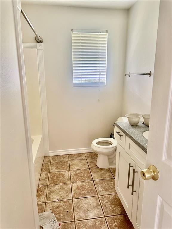 full bathroom featuring toilet, vanity, tile patterned floors, and shower / bathtub combination