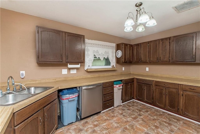 kitchen featuring decorative light fixtures, dark brown cabinetry, a notable chandelier, sink, and dishwasher