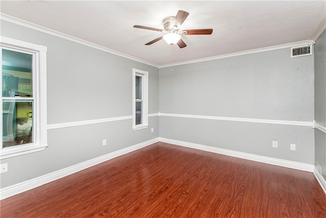unfurnished room with a ceiling fan, wood finished floors, baseboards, and ornamental molding