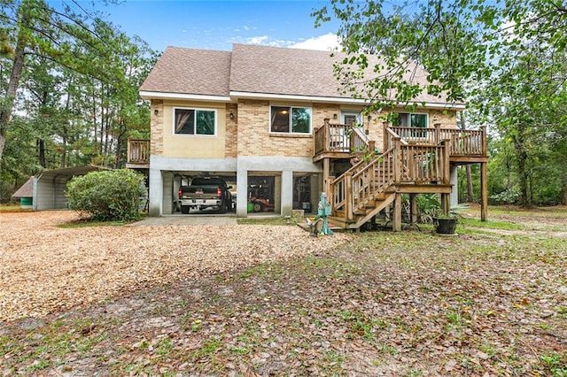 back of house featuring a carport