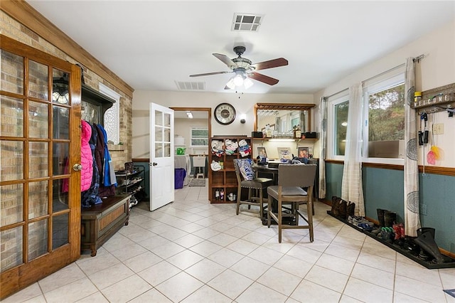 office area with ceiling fan and light tile patterned floors