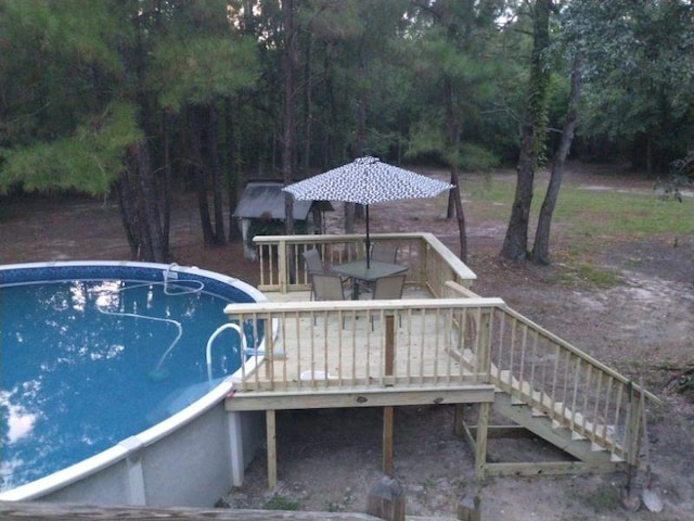 view of pool featuring a wooden deck