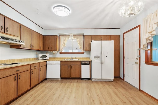 interior space featuring light hardwood / wood-style flooring and wood walls