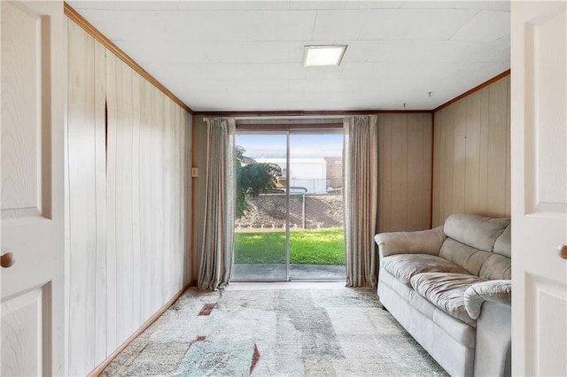 carpeted empty room featuring an inviting chandelier