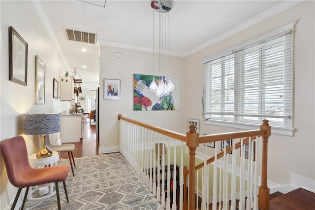 hallway featuring hardwood / wood-style floors and ornamental molding