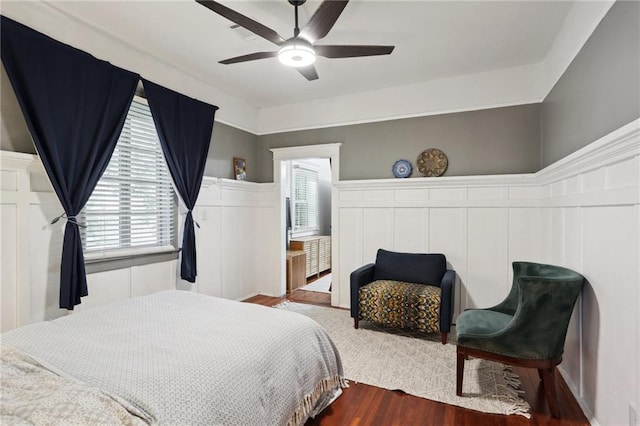 bedroom featuring ceiling fan and hardwood / wood-style flooring