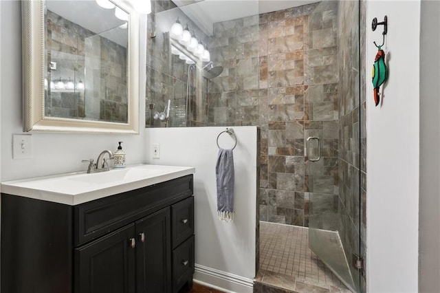 bathroom with vanity and a shower with door