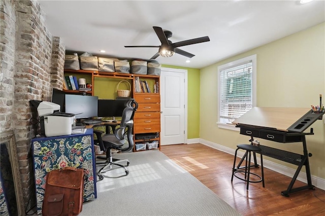 home office featuring ceiling fan and hardwood / wood-style floors