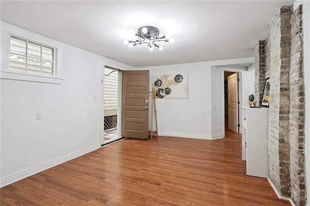 spare room with wood-type flooring