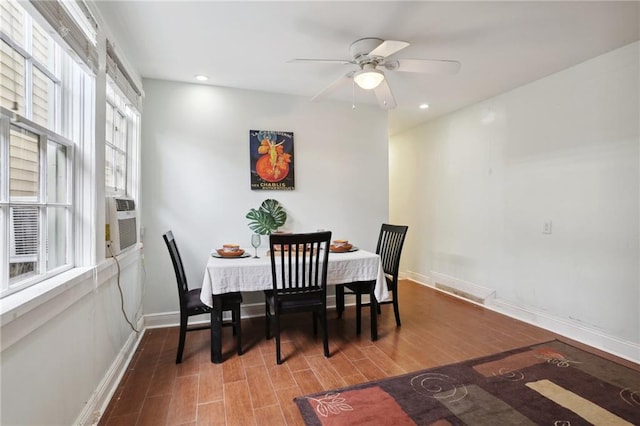 dining area with wood-type flooring, ceiling fan, and cooling unit