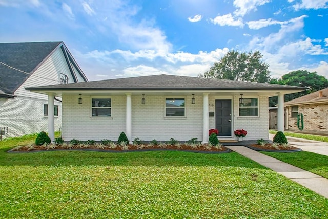 view of front facade with a front lawn and a porch