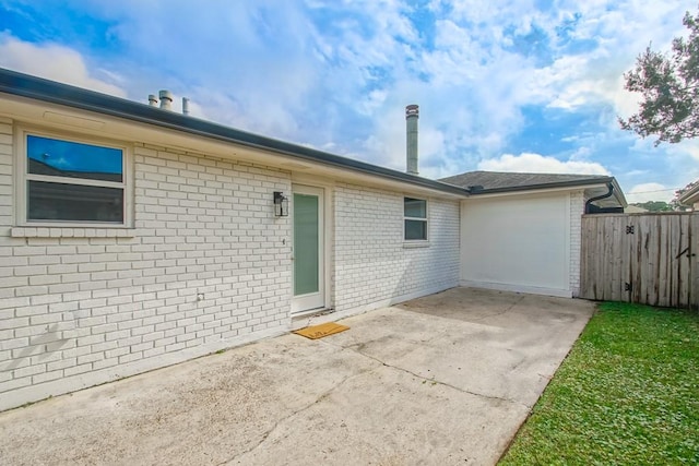 back of house with a patio