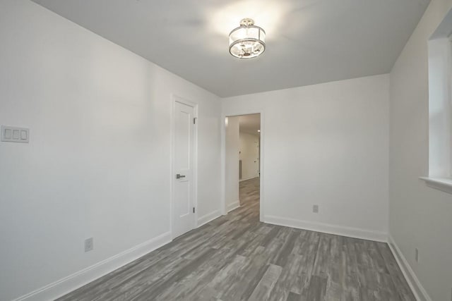 empty room featuring wood-type flooring