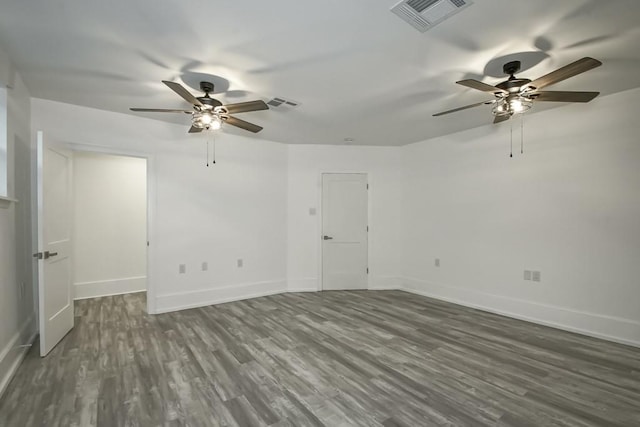 unfurnished room featuring dark hardwood / wood-style flooring and ceiling fan