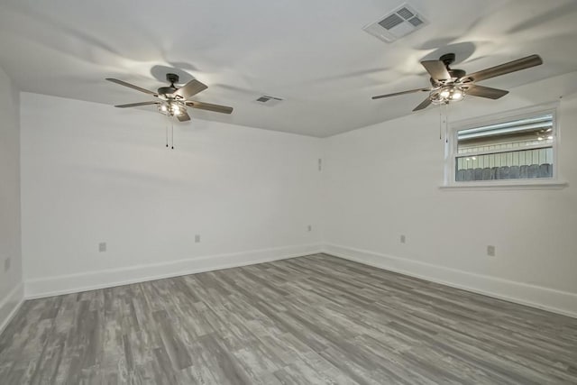 unfurnished room with ceiling fan and wood-type flooring