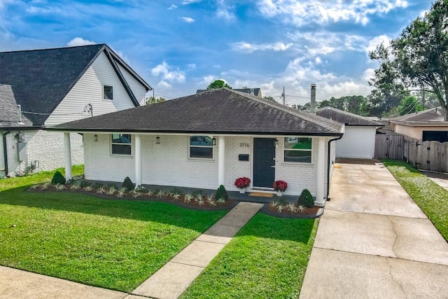 view of front of house featuring a front yard and a porch