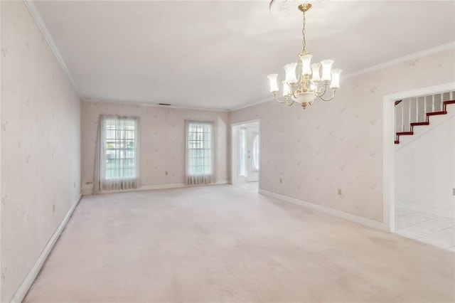 carpeted empty room with a chandelier and crown molding