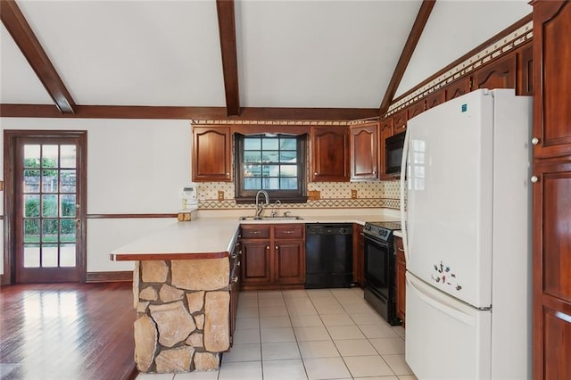 kitchen featuring light hardwood / wood-style floors, kitchen peninsula, decorative backsplash, black appliances, and lofted ceiling with beams