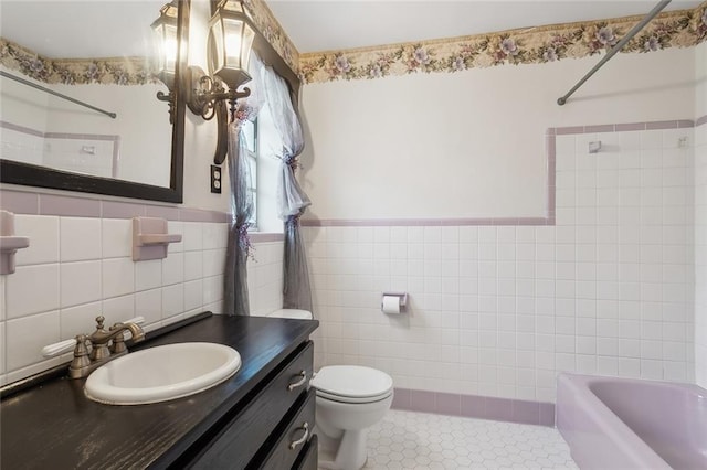 full bathroom featuring vanity, tile patterned flooring, toilet, and tile walls