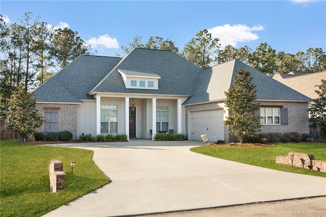 view of front of property featuring a garage and a front yard