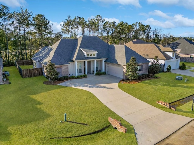 view of front of property featuring a garage and a front lawn