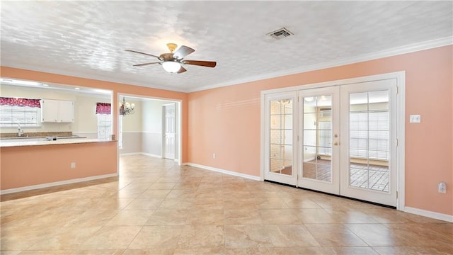 interior space featuring sink, french doors, ceiling fan, and crown molding